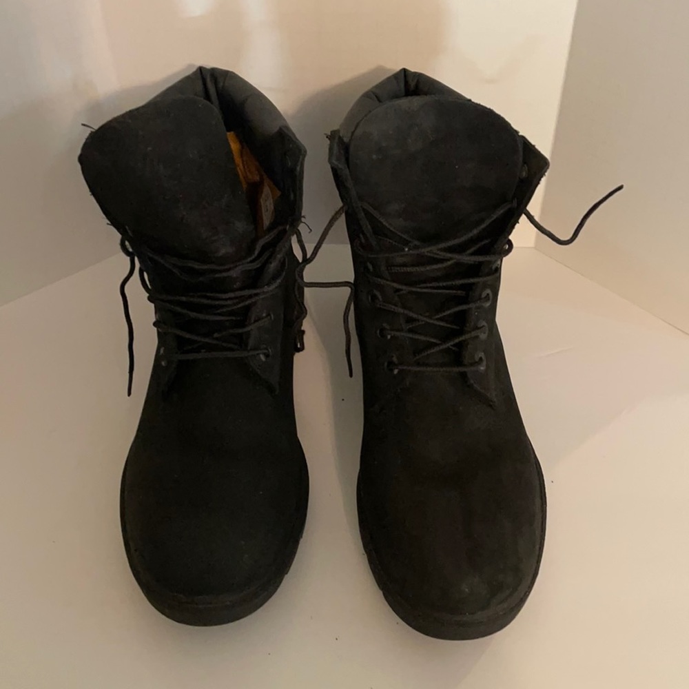 Black Timberland boots.